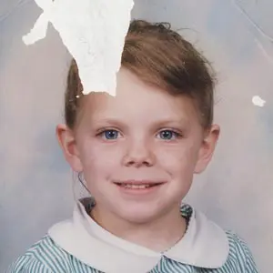 Before — damaged photo with missing section
